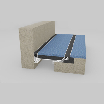 Wabo®SeismicPan (SPJ) seismic floor to wall interior pan expansion joint cover with flush installed carpet flooring by Sika Emseal