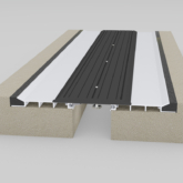 Wabo®Seismic SafetyFlex (SSF) seismic hinged expansion joint slip-resistant recessed cover plate system for wide joint openings in stadiums, parking garages, car parks, decks, and floors by Sika Emseal